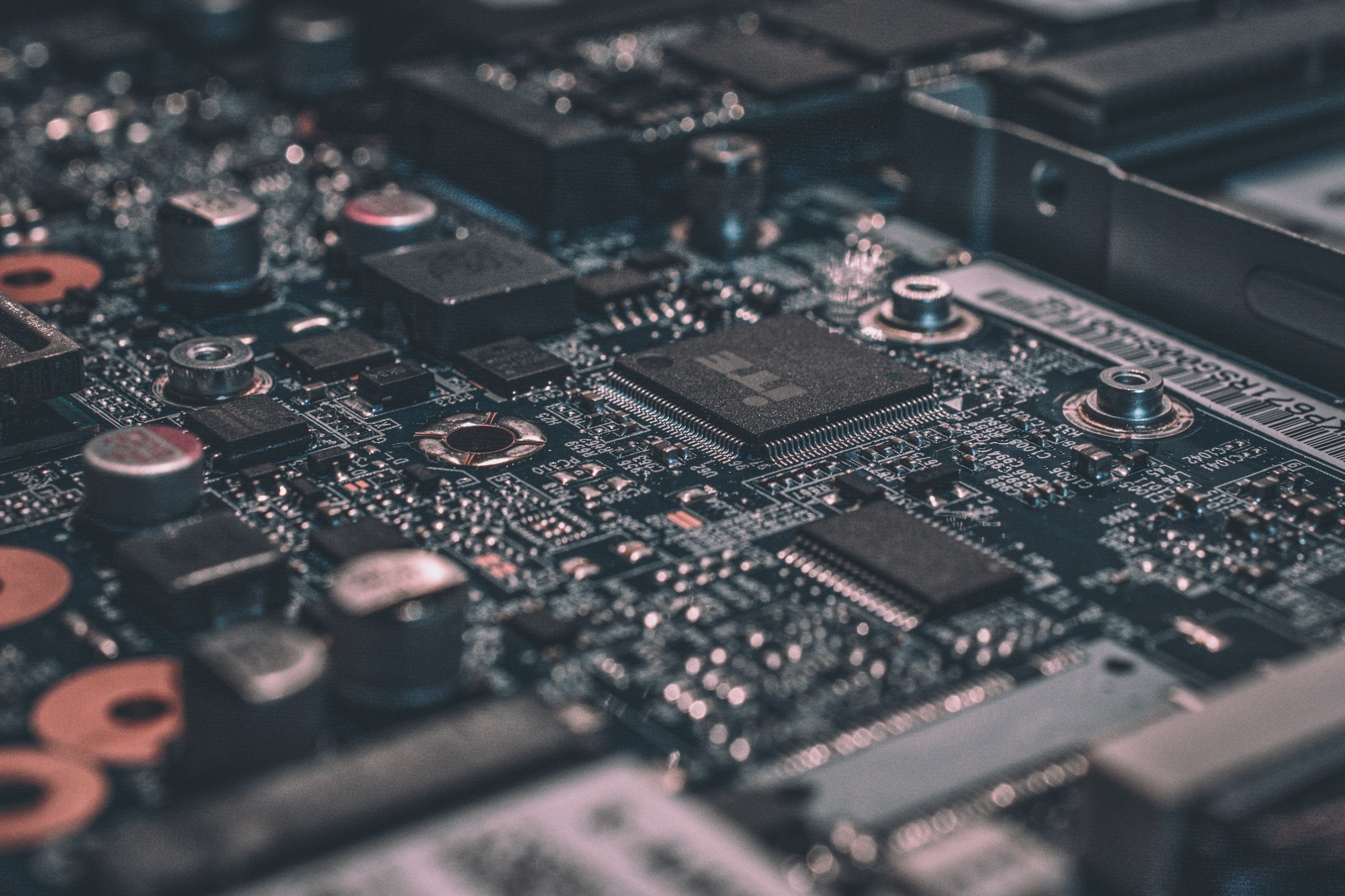 Macro shot of an electronic circuit board with microchips and integrated components for advanced computing systems